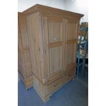 PINE 2 DOOR WARDROBE OVER BASE WITH 2 DRAWERS ON BRACKET SUPPORTS.