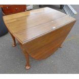 WALNUT DROP LEAF TABLE ON QUEEN ANNE SUPPORTS.