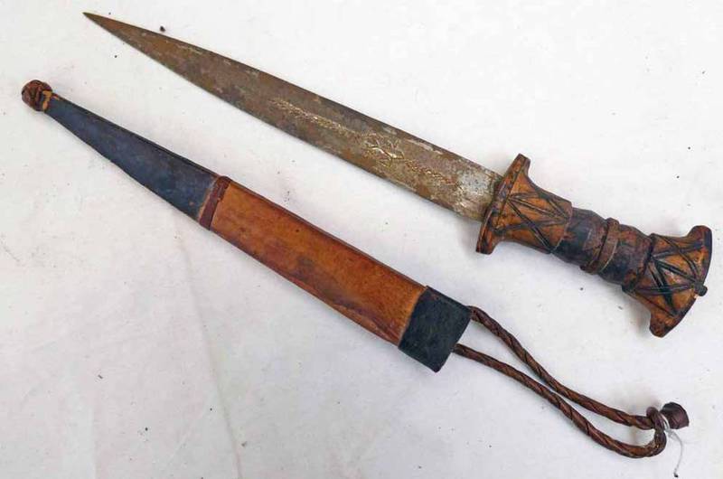 TRIBAL DAGGER WITH 20CM LONG DOUBLE EDGED BLADE WITH DECORATION ON A CARVED WOODEN GRIP WITH ITS