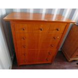 YEW WOOD CHEST OF 3 SHORT OVER 4 LONG DRAWERS ON TAPERED SUPPORTS.