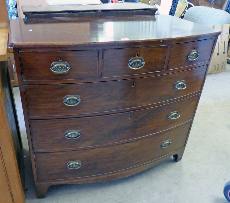 19TH CENTURY MAHOGANY BOW FRONT CHEST OF 3 SHORT OVER 3 LONG DRAWERS ON BRACKET SUPPORT.