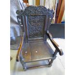 19TH CENTURY OAK CHAIR WITH PANEL BACK & CARVED DECORATION ON TURNED SUPPORTS WITH UNDERSTRETCHERS