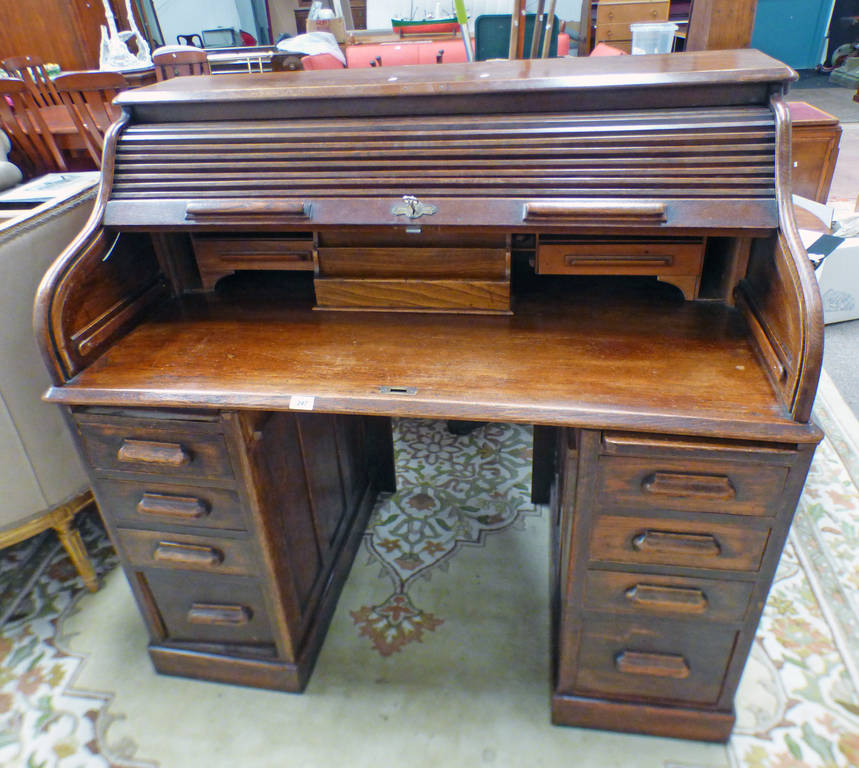 EARLY 20TH CENTURY OAK TWIN PEDESTAL ROLL TOP DESK WITH FITTED INTERIOR AND FRIEZE DRAWER FLANKED