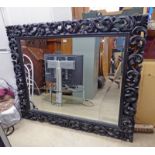 MIRROR WITH DECORATIVE FRAME GLASS AS SEEN OVERALL SIZE 127 X 151 CM