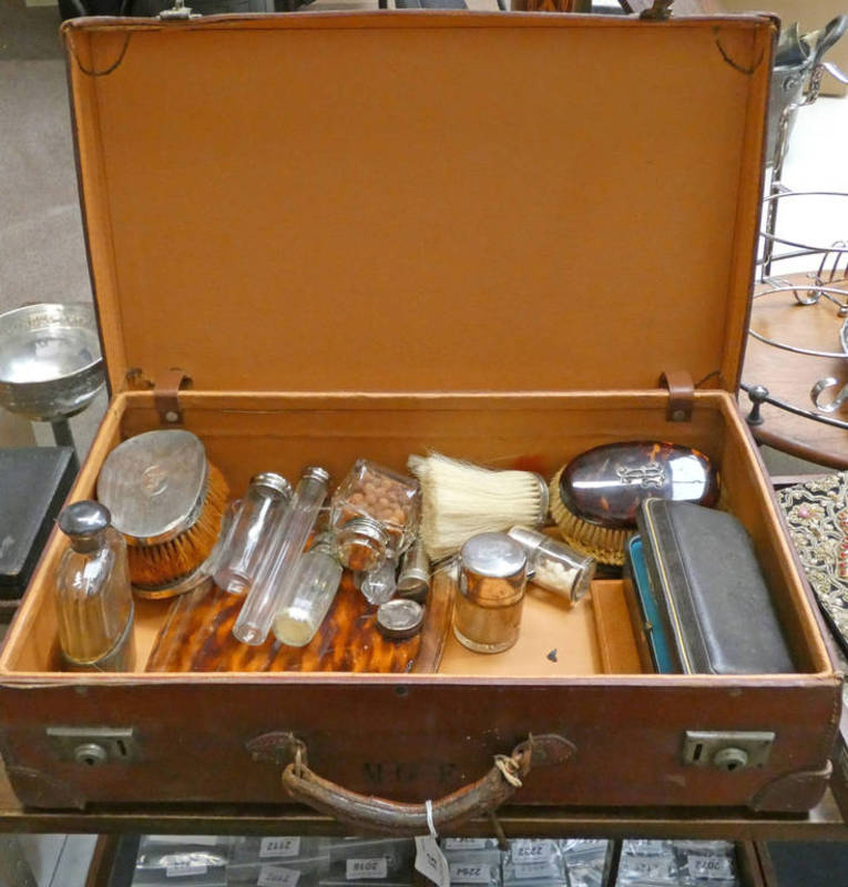 LEATHER SUITCASE WITH VARIOUS SILVER TOPPED AND OTHER JARS, SILVER BACKED BRUSHES,