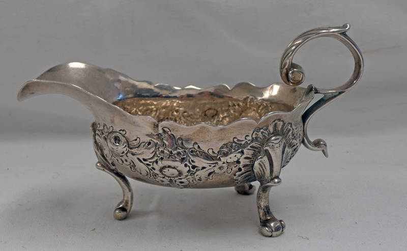 GEORGE II SILVER CREAM BOAT WITH EMBOSSED DECORATION,