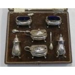 CASED SILVER 6 PLACE CRUET SET,