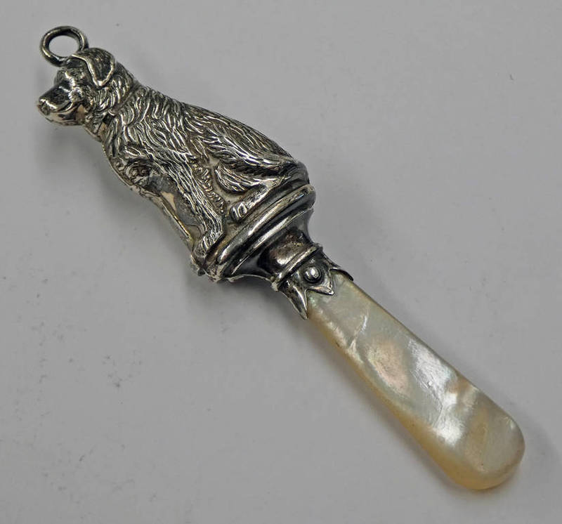 SILVER DOG SHAPED CHILDS RATTLE WITH MOTHER OF PEARL HANDLE,