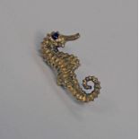 9CT GOLD SEAHORSE BROOCH WITH GARNET EYE - 7.5G Condition Report: Length: 3cm.