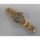 18K GOLD LADYS ROLEX AUTOMATIC DATE JUST WRISTWATCH WITH CHAMPAGNE DIAL .