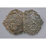 LARGE SILVER BUCKLE WITH PIERCED FLORAL DECORATION,