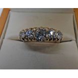 5 STONE DIAMOND SET RING WITH SCROLL WORK SETTING Condition Report: Ring size:
