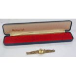 9CT GOLD LADIES ACCURIST WRISTWATCH ON A 9CT GOLD BRACELET - 11.