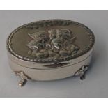 SILVER OVAL JEWELLERY BOX DECORATED WITH CHERUBS,
