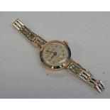 9CT GOLD LADIES WRISTWATCH ON A GOLD PLATED BRACELET