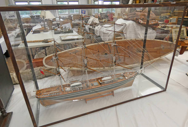 MODEL OF THE CUTTY SARK IN A DISPLAY CASE 75CM TALL, 113CM WIDE AND 37CM DEEP.