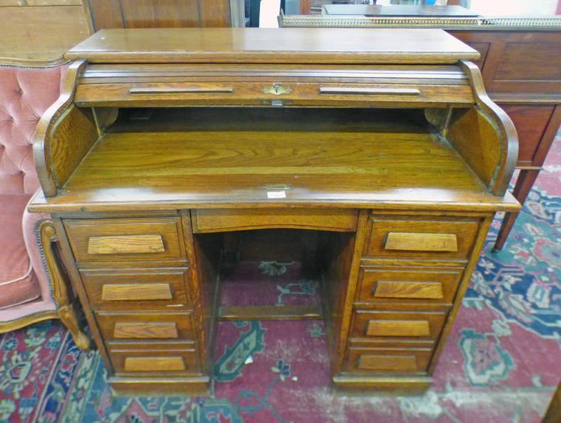 OAK ROLL TOP DESK WITH CENTRAL FRIEZE DRAWER OVER 8 DRAWERS,