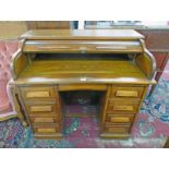 OAK ROLL TOP DESK WITH CENTRAL FRIEZE DRAWER OVER 8 DRAWERS,