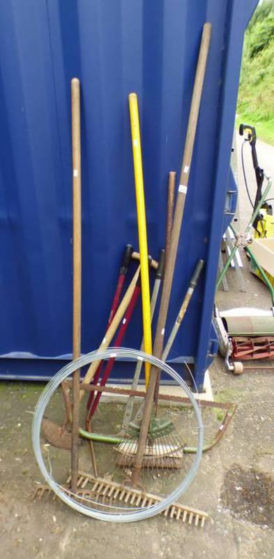 SELECTION OF VARIOUS TOOLS TO INCLUDE RAKE, GARDEN LOPPERS, SPOOL OF WINE,