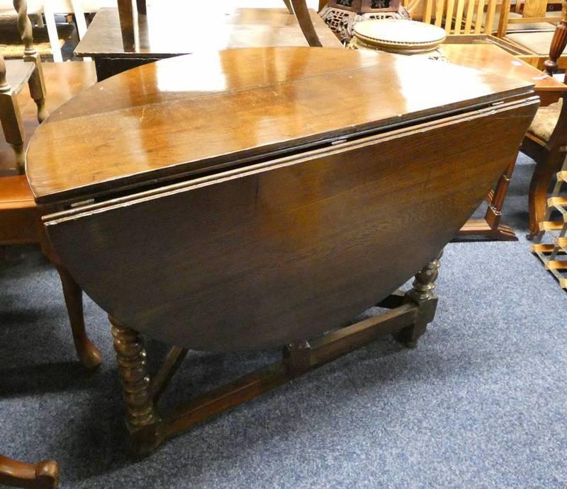 19TH CENTURY OAK DROP LEAF TABLE ON BARLEY TWIST SUPPORTS