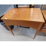TEAK CASED SINGER SEWING MACHINE ON TAPERED SUPPORTS