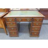 EARLY 20TH CENTURY OAK KNEEHOLE DESK WITH LEATHER INSERT AND 3 FRIEZE DRAWERS OVER 6 DRAWERS,