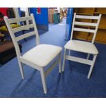 2 WHITE LEATHER COVERED CHAIRS BY H J BERRY