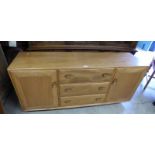 ERCOL BEECH BLONDE SIDEBOARD WITH 3 CENTRAL DRAWERS FLANKED BY PANEL DOOR EACH SIDE,