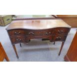 LATE 19TH CENTURY MAHOGANY KNEEHOLE DESK WITH SERPENTINE FRONT AND FRIEZE DRAWER FLANKED BY 2