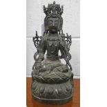 ORIENTAL METAL SEATED BUDDHA FIGURE ON LOTUS LEAF WITH TRACES OF GILDING 32CM TALL