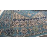 BLUE GROUND MIDDLE EASTERN RUG - 240 X 150 CMS