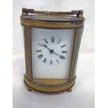 OVAL CASED BRASS CARRIAGE CLOCK Condition Report: Sold as seen with no guarantee.
