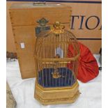 20TH CENTURY SINGING BIRD CAGE, BIRD WITH AUTOMATION IN ITS GILT CAGE AND BASE,