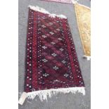 EASTERN RUG WITH MAROON & WHITE DECORATION,