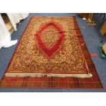 TWO RUGS WITH RED & CREAM DECORATION.