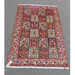 EASTERN RUG WITH MAROON & WHITE DECORATION,