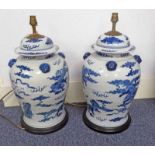 PAIR OF CHINESE BLUE & WHITE TEMPLE JARS CONVERTED TO TABLE LAMPS WITH LION DOG DECORATION 51CM