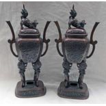 PAIR OF 19TH CENTURY JAPANESE BRONZE LIDDED VASES ON 4 SHAPED SUPPORTS WITH OVAL BASES - 36CM TALL