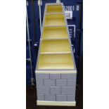 PAINTED PYRAMID OPEN BOOKCASE OVER BASE WITH PANEL DOOR.