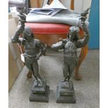 PAIR OF METAL FIGURES HOLDING TORCHES ON PLINTH BASES - 59 CM TALL