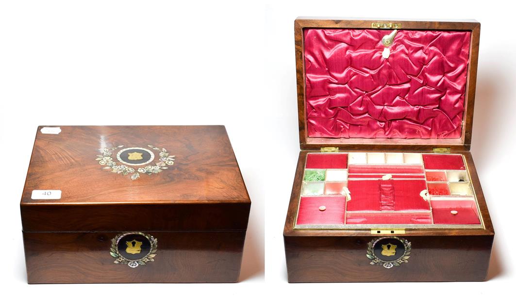 A Victorian walnut work box inlaid with mother-of-pearl