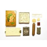 A 19th century Canton carved ivory aide memoir, a carved ivory Chinese parcel, silver, coins, etc
