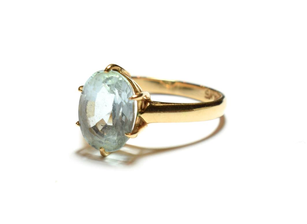 A blue topaz ring, stamped '9K', finger size Q. Gross weight 3.4 grams.