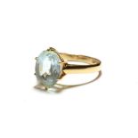 A blue topaz ring, stamped '9K', finger size Q. Gross weight 3.4 grams.