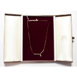 A 9 carat gold gem set necklace, length 42cm . Gross weight 4.2 grams.