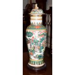 A late 19th century Chinese large famille verte vase and cover, decorated with Chinese figures