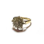 A 9 carat gold diamond cluster ring, finger size S. Gross weight 4.9 grams.