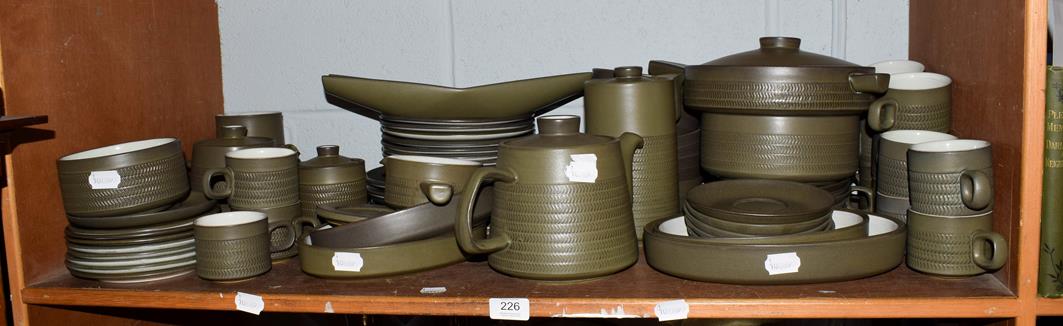 A large collection of Denby Stoneware dinner and tea wares, green ground (one shelf)