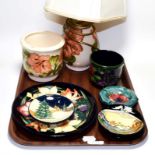 Eight items of modern Moorcroft including lamps and dishes (8). No chips, cracks or repair. Some