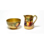 A Royal Worcester fruit painted milk jug, signed T.Lockyer and a Royal Worcester fruit painted bowl,